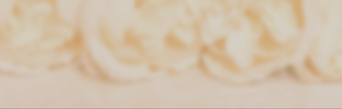 Close up of creamy roses with a soft focus effect and a pink overtone