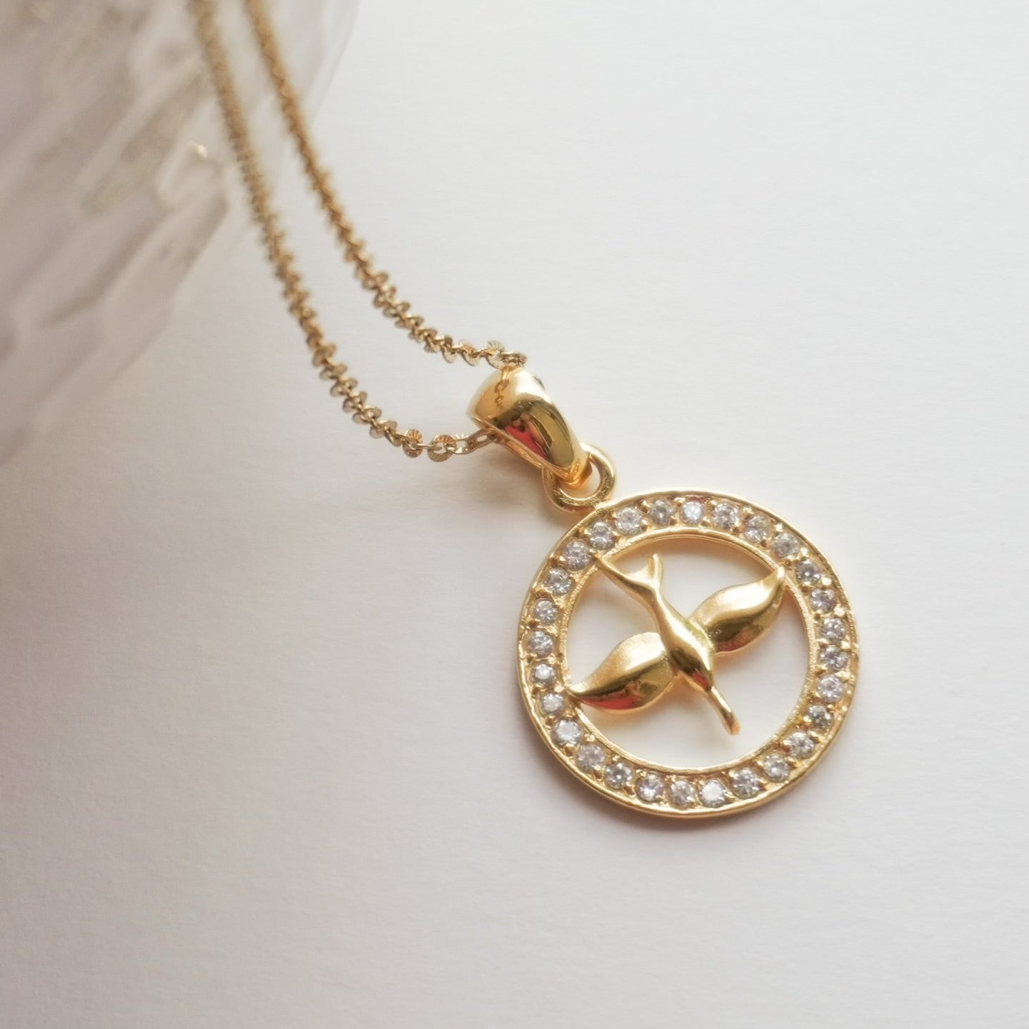 Holy Spirit pendant has gold over sterling silver and surrounded by a circle of cubic zirconia stones