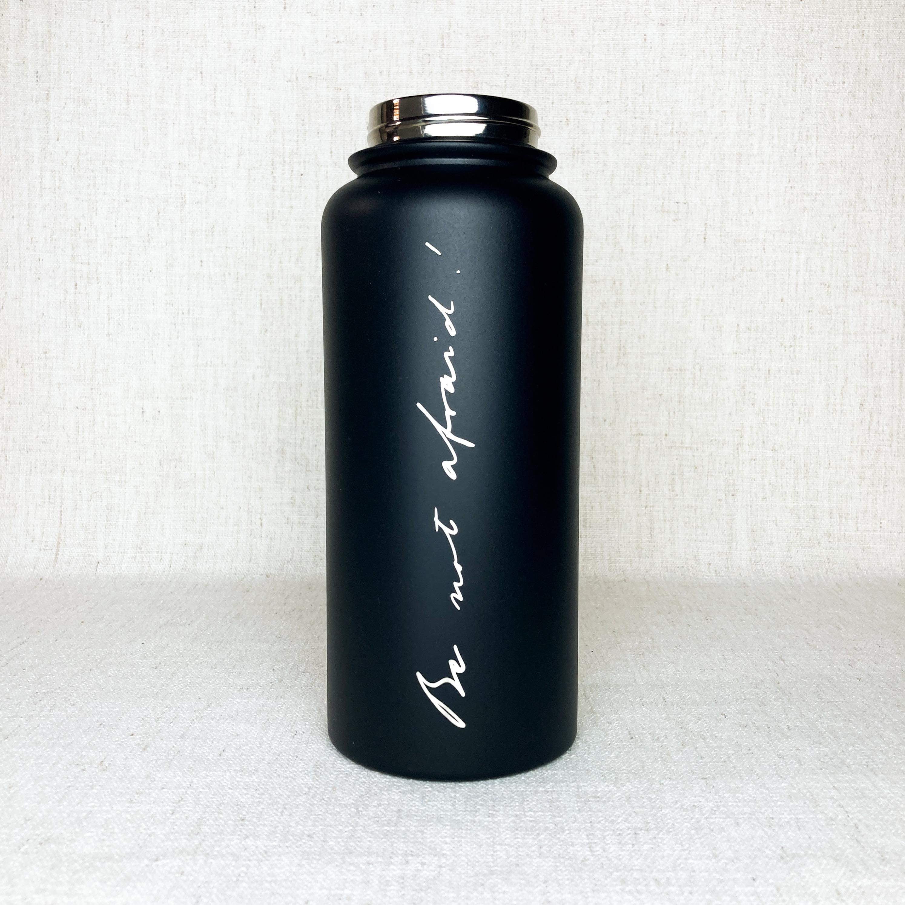 Black stainless steel powder coated water bottle with phrase "Be not afraid" engraved in the handwriting of John Paul II