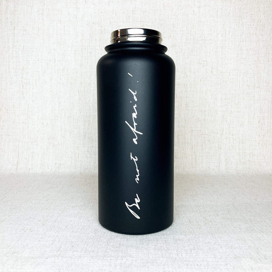 Black stainless steel powder coated water bottle with phrase "Be not afraid" engraved in the handwriting of John Paul II